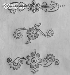 some flowers and leaves are drawn on paper