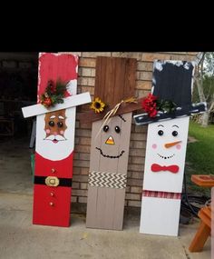 three wooden doors decorated with christmas decorations