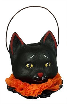 a black cat purse with an orange ribbon around it's neck and eyes, on a white background