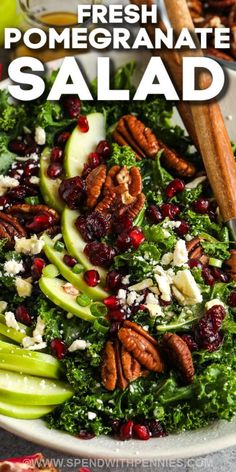 a salad with apples, pecans and cranberries in it on a plate