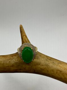 vintage green fun jade ring  Setting is a golden finished bronze setting  This is one of my hand re finished treasures. Salvaged from vintage.  Size   7.5 Re sizing can be done for a $20 fee and may take up to a week.  Engraving is $4 per letter.  Thank you for supporting a veteran's small business. All jewelry is shipped free within the US in a stylish gift box Antique Gold Emerald Ring With Oval Cabochon, Antique Emerald Ring In Gold With Oval Cabochon, Heirloom Green Oval Cabochon Jewelry, Antique Green Oval Cabochon Ring, Vintage Green Oval Cabochon Jewelry, Antique Green Oval Jewelry, Vintage Oval Jade Emerald Ring, Heirloom Oval Green Jewelry, Heirloom Green Oval Jewelry