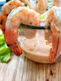 some shrimp sticks sticking out of a glass bowl