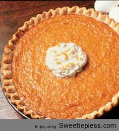 an orange pie with whipped cream on top