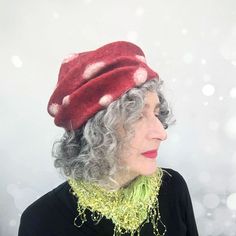 Introducing the whimsical Felted Amanita Mushroom Hat, a truly enchanting accessory that adds a touch of magic to your wardrobe. This hat is handcrafted with meticulous attention to detail, capturing the essence of the iconic red Amanita mushroom in a delightful and whimsical design. Wear this hat and let your imagination run wild as you embody the whimsy and charm of these fantastical fungi. COLOUR: • This felted hat is a glowing red with creamy white spots. The innermost layer of wool is a gre Whimsical Red Winter Hat, Whimsical Red Brimmed Hat, Red Hat As A Gift, Red Hat As A Gift, One Size Fits All, Handmade Red Mini Hat With Short Brim, Red Bohemian Hat As A Gift, Red Bohemian Hat As Gift, Handmade Red Hat One Size, Whimsical Red Hat As Gift