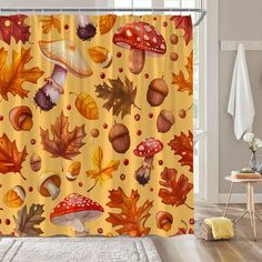 a shower curtain with autumn leaves and mushrooms on it