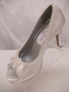 SALE THIS PAIR ONLY REG PRICE: $162.00 NOW: $138.00 READY TO SHIP SHOES USA SIZE: 5.5 (5 1/2), AS SHOWN IN PICTURE. *If you need a different color or size please see below. Beautiful Shoes for Todays Brides! : 3 1/4'' Heels Beautifully embellished with iridescent pearls edging; Shoes are peep toes with an iridescent embellishment, soooo, cute Shoes have platform to rest your feet :) the back heel of the shoe has a cute iridescent embellishment, please look at all the pictures *Need this shoe is Embellished Fitted Round Toe Wedding Shoes, Embellished Fitted Wedding Shoes With Closed Toe, Embellished Open Toe Wedding Shoes For Gala, Fitted Silver Open Toe Wedding Shoes, Silver Open Toe Fitted Wedding Shoes, White Open Toe Wedding Shoes For Gala, Open Toe Embellished Wedding Shoes For Formal Occasions, White High Heel Shoes, Modern Cinderella