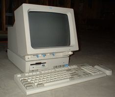 an old computer sitting on top of a floor