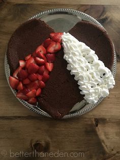 a chocolate cake with strawberries and whipped cream