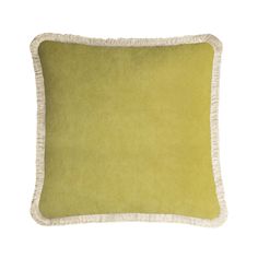 a green and white pillow with fringes on the bottom, in front of a white background