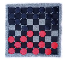 a black and white checker board with red circles on it's surface,