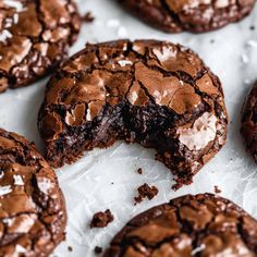 chocolate cookies with white frosting and broken in half