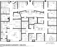 an office floor plan with several cubicles and desks in the center, along with two