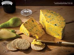 cheese and crackers on a wooden cutting board