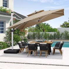 an outdoor dining table and chairs with an umbrella over it next to a swimming pool