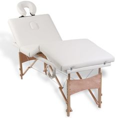 a white portable massage table with wheels attached to the back and side of the bed