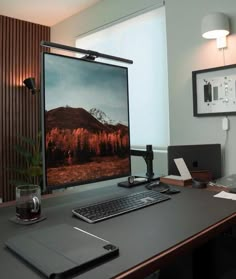 a desktop computer sitting on top of a wooden desk