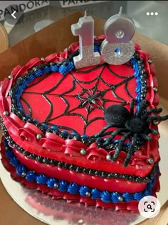 a heart shaped cake decorated with red, white and blue icing