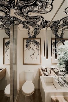 the bathroom is decorated with black and white lines on the ceiling, along with two sinks