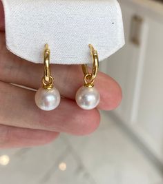 Pearls: -Type: freshwater pearls -Luster: Excellent -Size: 9-10mm -Shape: round -Surface: very clean, almost no blemish -Color: white Materials: -real gold plated over sterling silver hooks Thanks for visiting CISA Jewelry Store! Just for you design! Classic White Huggie Pearl Earrings, Hypoallergenic Akoya Pearl Earrings Gift, Hypoallergenic Akoya Pearl Earrings For Anniversary, Pearl Drop Earrings For Anniversary And Mother's Day, Pearl Huggie Earrings For Anniversary, Wedding Huggie Pearl Charm Earrings, Pearl Huggie Earrings As Gift, Pearl Huggie Jewelry For Anniversary, Wedding Pearl Huggie Earrings