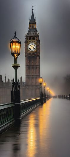 the big ben clock tower towering over the city of london on a foggy day