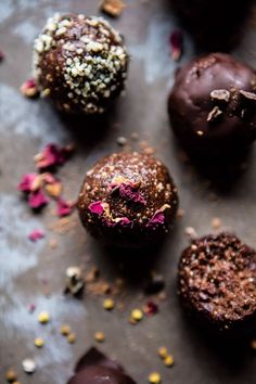 chocolate covered donuts with sprinkles and confetti on the side