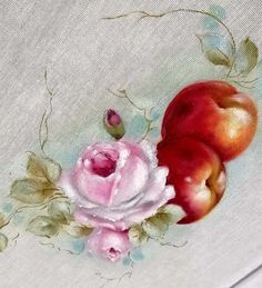 a painting of apples and roses on a white cloth