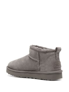 Find UGG Classic Ultra Mini Suede Boots on Editorialist. grey calf suede wool blend branded heel counter round toe pull-tab at the heel branded insole flat rubber sole slip-on style We've partnered with Good On You — an independent agency that rates how brands perform in relation to their impact on the planet, people and animals, with a multi-criteria rating simplified to a five points scale. In order to be awarded our conscious label, larger brands need to score a minimum of four out of five ('Good'), while smaller brands must score at least three out of five ('It's A Start'). This item comes from a brand rated three out of five ('It's A Start') by Good on You at the time it was added on FARFETCH. Please note, this is a brand-level rating and does not guarantee that this product is made w Gray Boots With Cushioned Footbed And Round Toe, Gray Cushioned Boots With Round Toe, Gray Round Toe Boots With Cushioned Footbed, Gray Cushioned Round Toe Boots, Ugg Ultra Mini Boots, Grey Uggs, Ugg Shoes Women, Grey Ugg Boots, Ugg Ultra Mini