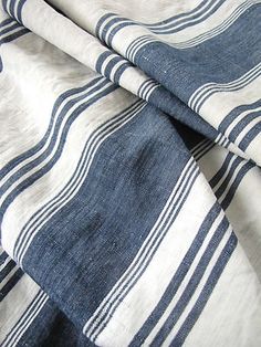 the blue and white striped fabric is folded up