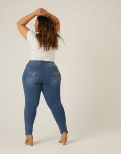 The Plus Size Distressed Skinny Jeans are a great, classic pair of jeans. These jeans feature a high waist, light distressing, functional pockets, real belt loops, and a zipper and single button closure. They are super stretchy, comfortable, and form-fitting. These jeans are made from 51% cotton, 22% tencel, 18% polyester, 7% viscose, and 2% spandex. Machine wash cold. Imported. Model is 6’ tall, has a 42” waist, 58” hips, a 40DDD bust, and is wearing a size 3XL. The woven denim material is supe Intelligent Clothes, High Waisted Jeans Outfit, Plus Size Posing, Fashion Design Template, Seductive Clothes, Curvy Model, Curvy Plus Size, Plus Size Jeans, Medium Blue