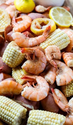 shrimp, corn on the cob and lemon wedges are ready to be cooked