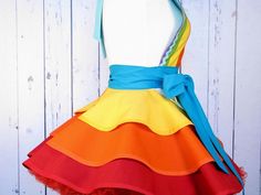 a colorful dress is displayed on a mannequin