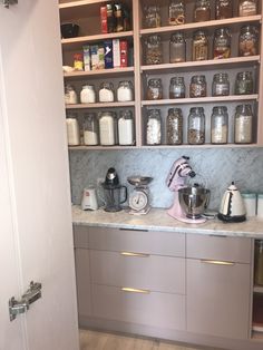 the kitchen is organized and ready to be used as a coffee bar or pantry area