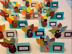 a table topped with lots of paper turkeys