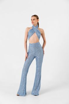 You will love this co-ord sets for women! This trouser set consisting of flared trousers and wrap top is handmade from a soft fabric covered with blue sequins. The wide leg trousers will hug you like a second skin, keeping you comfortable at all times and revealing all your body curves. You can create the model you want by tying the sequin wrap top to the length you want. FULLY SEQUINED FABRIC : Shine brighter than ever before and turn heads with bold, sparkly designs with a pair of Studio 54 Fa Fitted Jumpsuits And Rompers For Party, Fitted Trousers Jumpsuits And Rompers For Party, Fitted Trousers Jumpsuit For Party, Fitted Long Pants Jumpsuits And Rompers For Party, Fitted Party Jumpsuits And Rompers With Long Pants, Fitted Long Pants Jumpsuits For Party, Chic Flare Sets For Party, Chic Flared Party Sets, Stretch Pantsuit For Party