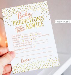 a person holding up a baby dedication and advice card with gold confetti on it