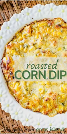 a baked corn dip on a plate with the words roasted corn dip written in green