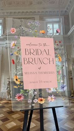 a sign that says welcome to the bridal brunch with flowers on it