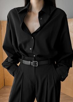 Color: Black Lightweight breathable shirting fabric Oversized fit Pointed collar Button front closure Button cuffs 65% Tencel 25% Rayon 10% Wool Dry Clean By The Frankie Shop. Imported Product Measurements: XS/S- 21" Shoulder, 49" Bust, 29" Length M/L- 21.5" Shoulder, 51" Bust, 29.5" Length Model is 175cm/5'9" wearing size XS/S Mysterious Clothes Aesthetic, Black Vintage Aesthetic Outfits, Button Up Black Shirt Outfit, Black Oversized Blouse Outfit, Dark Casual Outfits Women, Black Shirt Outfit Women Classy, Oversized Black Shirt Outfit, Black Button Down Outfit, Over Sized Shirt Outfit