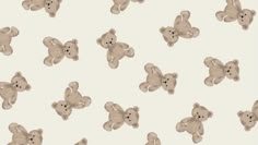 a group of teddy bears sitting next to each other on a white wallpaper background