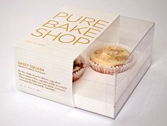 a white box that has some cupcakes inside of it and is open to show the packaging