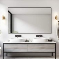 a white bathroom with two sinks and a large mirror above the sink is next to a bathtub