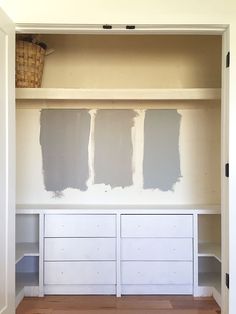 the paint colors are being applied on the wall behind the cabinets in the room that is under construction