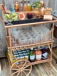 an old fashioned bar cart filled with drinks