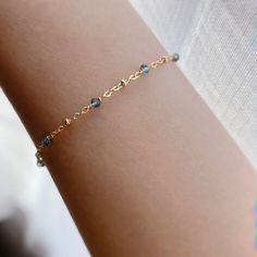 "* DETAILS* This dainty bracelet is a perfect gift to the one you love or to yourself. A nice every day bracelet. - AAA+ London Blue Topaz Faceted Beads 2mm - 14k Gold Filled Chain - 14K Gold Filled Wire - 14k Gold Filled Spring Ring Clasp - 14k Gold Filled Link Rings - Bracelet has a 1\" Extension ✨All components are gold filled. 👉🏻For more birthstone bracelets, see https://www.etsy.com/shop/JinnysJewelryBySeJin You may also like 🌟Sapphire Bracelet. https://www.etsy.com/JinnysJewelryBySeJin/ Jewelry Drawer, Carnelian Bracelet, Special Birthday Gifts, Emerald Bracelet, Birthday Gift For Women, Emerald Bead, Birthstone Bracelet, Dainty Bracelet, Sapphire Bracelet