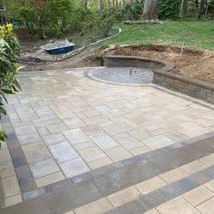 an outdoor patio that is being built in the middle of a yard, with steps leading up to it