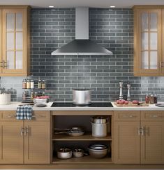 a kitchen with wooden cabinets and gray brick wall tiles on the backsplash is shown