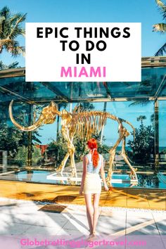 a woman standing in front of a dinosaur skeleton with the words epic things to do in miami