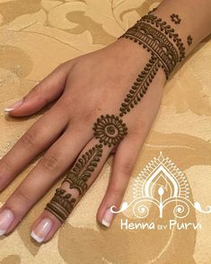 henna tattoo on the palm of a woman's hand