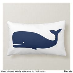 a pillow with a blue whale on it's back and the words maritime kirschenmarr in german