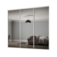 an image of a bedroom that is in black and white with mirrored doors on the wall